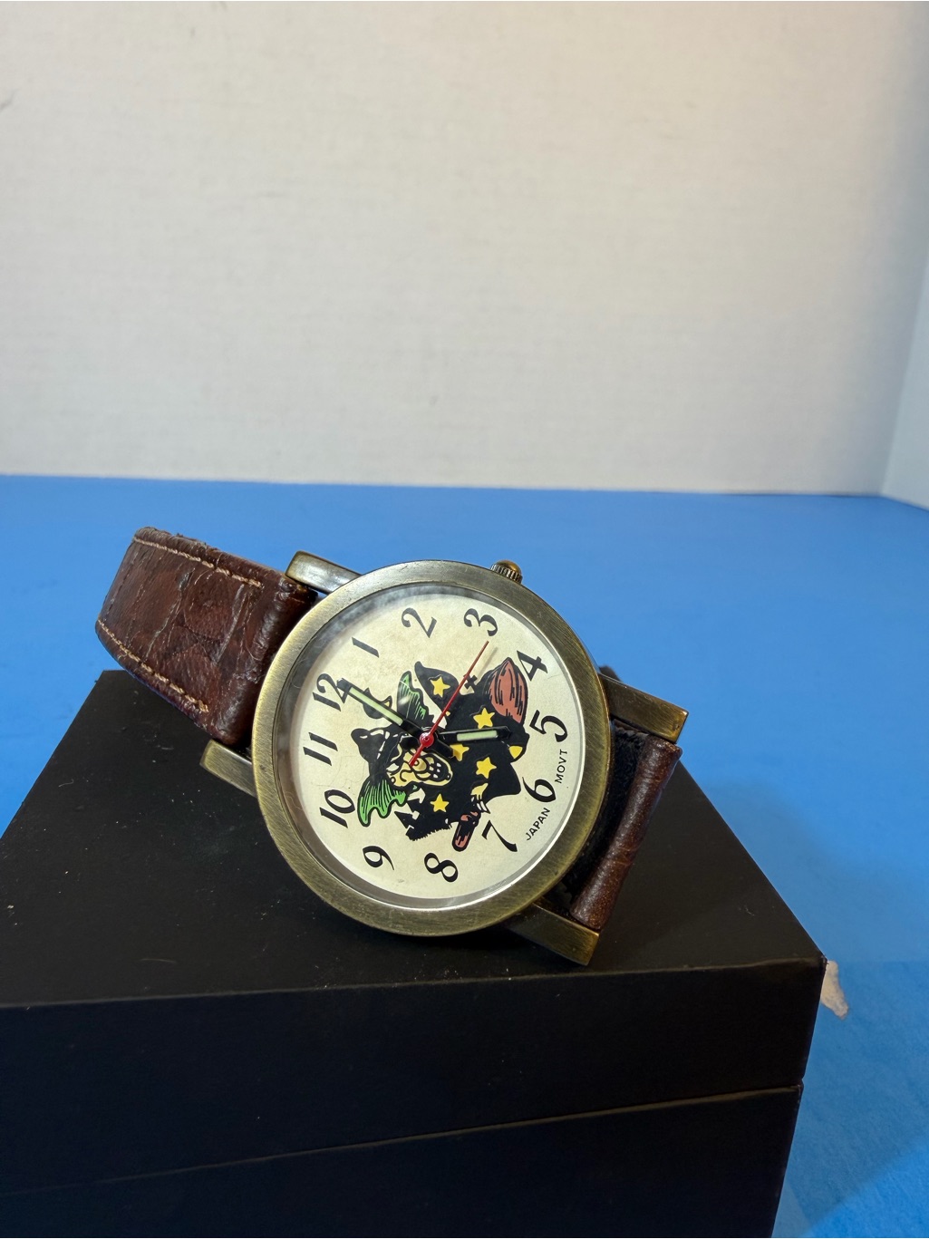 Vintage-style men's wristwatch on a leather strap, photographed for a marketplace listing